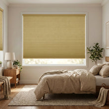 Load image into Gallery viewer, Interior view of a peaceful bedroom styled with Beige (Amber) 1 2 Inch Budget Single Cell Blackout Cordless Shades, eliminating unwanted sunlight for optimal sleep.