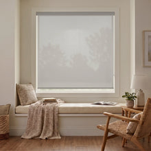 Load image into Gallery viewer, Classic Fabric Light Filtering Roller Shades in Beige add warmth and elegance to this modern living room, filtering natural light with ease.