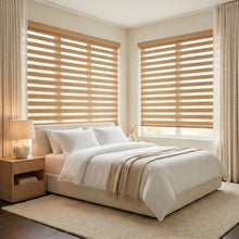 Load image into Gallery viewer, Zebra Light Filtering Roller Shades in beige harmonize with modern bedroom decor, filtering natural light and enhancing serenity.