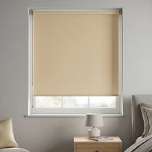Load image into Gallery viewer, The clean lines of a Beige Navajo Signature blackout roller shade, designed for maximum functionality and style.