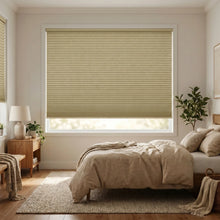 Load image into Gallery viewer, A look at Beige (Tussah) 1 2 Inch Budget Single Cell Blackout Cordless Shades inside a peaceful bedroom, offering maximum privacy and light control.