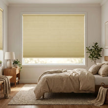 Load image into Gallery viewer, Beige (Vanilla) 1 2 Inch Budget Single Cell Blackout Cordless Shades installed in a inviting bedroom, creating a serene, light-free setting.