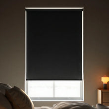 Load image into Gallery viewer, Sophisticated Black Signature room darkening shades styled in a minimalist bedroom with neutral accents.