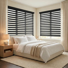 Load image into Gallery viewer, Modern bedroom ambiance with Zebra Light Filtering Roller Shades in black, effortlessly filtering out harsh light while maintaining a stylish look.