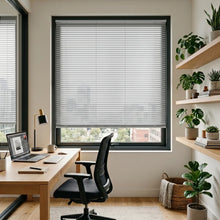 Load image into Gallery viewer, Custom window treatments: Blackwhite (Textured Aluminum) Classic Cordless 6g Aluminum Mini Blinds shown in a cozy study, perfect for high-traffic areas requiring durable light management.