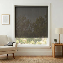 Load image into Gallery viewer, Premier 3% Solar Screen Roller Shade effectively filters sunlight while maintaining a stylish, charcoal black appearance in this inviting living room.