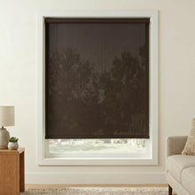 Load image into Gallery viewer, Premier dark brown chocolate 1% Solar Screen Roller Shade adds sleek charm to this living room, blocking UV rays while allowing natural light in.