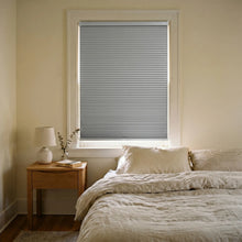 Load image into Gallery viewer, This serene bedroom is enhanced by Charcoal Grey (Gray Sheen) 9 16 Inch Classic Single Cell Blackout Cordless Shades, shielding the interior from bright daylight and street lamps.