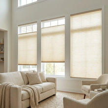 Load image into Gallery viewer, Cream 9 16 Classic Single Cell Light Filtering Cordless Top Downbottom Up Cordless Shades installed in a bright living space, allowing soft natural light while maintaining adjustable privacy.