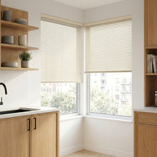 Load image into Gallery viewer, View of a cozy retreat with Creamy Alabaster Classic Cordless 6g Aluminum Mini Blinds, offering lightweight yet sturdy window coverage.