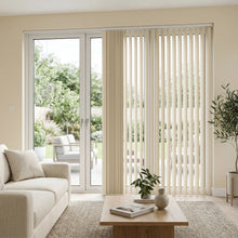 Load image into Gallery viewer, Classic curved vertical blinds made from PVC in a smooth finish. Featured in a modern living room setting in creamy white overlooking a garden.