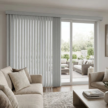 Load image into Gallery viewer, Creamy (Turnberry Washed Grey) 3 1/2 Inch S Shape Pvc Vertical Blinds providing a structured touch to a cozy living room, delivering a drapery-like aesthetic with easy-to-clean functionality.