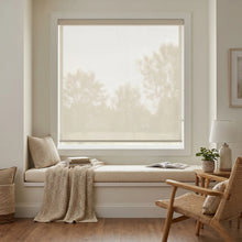 Load image into Gallery viewer, Classic Fabric Light Filtering Roller Shades in Creamy White provide soft, filtered light and cozy ambiance for this inviting living room.
