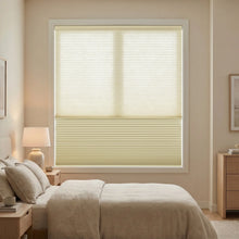 Load image into Gallery viewer, Creamy White (Ivory) 5 8 Daynight Single Cell Cellular Cordless Shades installed in a modern bedroom, adding a refined finishing touch to the interior.