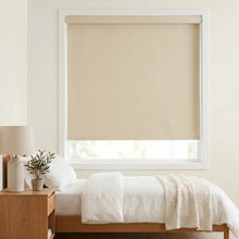 Load image into Gallery viewer, Elevate your bedroom's ambiance with Classic Fabric Blackout Roller Shades in Creamy White, perfect for a serene retreat.