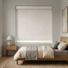 Load image into Gallery viewer, Modern Fabric Blackout Roller Shades in Creamy White add a touch of elegance to this serene modern bedroom, blocking out light and promoting a restful ambiance.