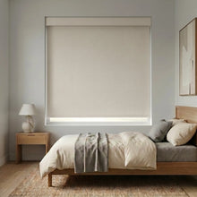 Load image into Gallery viewer, Modern Fabric Blackout Roller Shades in Creamy White elevate this serene bedroom sanctuary with seamless light blocking and timeless design.