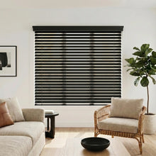 Load image into Gallery viewer, Immerse yourself in a serene atmosphere with the Hardwood Cordless Horizontal Blinds' sleek Deep Black slats, perfectly complementing the white window and beige and brown couches.