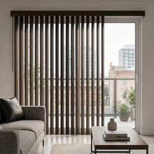 Load image into Gallery viewer, Wood Grain Faux Wood PVC Vertical Blinds expertly filter natural light into this inviting room, where plush sofas and rich rugs create a warm atmosphere