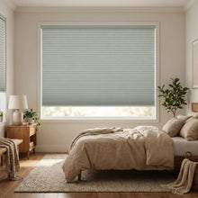 Load image into Gallery viewer, Styling a modern bedroom with Gray (Dove) 1 2 Inch Budget Single Cell Blackout Cordless Shades, offering maximum privacy and light control.