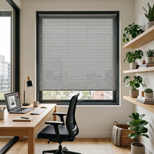 Load image into Gallery viewer, A light brown Hardwood Cordless Horizontal Blind seamlessly blends with white furniture and greenery, perfecting a minimalist room's calm ambiance.