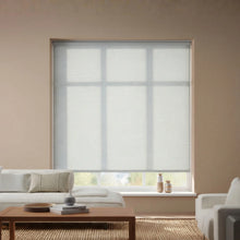 Load image into Gallery viewer, Sleek Kyra White Cloud Luxe natural light filtering shades providing soft, diffused light in a contemporary home.