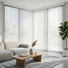 Load image into Gallery viewer, Wide view of Minty White (Snow White) Classic Curved Pvc Smooth Vertical Blinds complementing a modern living room, filtering incoming daylight effectively across wide glass surfaces.