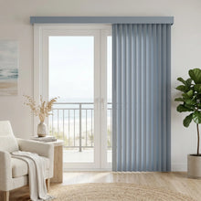 Load image into Gallery viewer, Ocean blue premier vertical blinds in a textured finish featured in a living room setting with coastal view.
