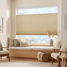 Load image into Gallery viewer, Simplistic Cordless Tdbu Pleated Shades effortlessly filter natural light in this serene living room, complementing beige blinds and plush white pillows on inviting chairs.