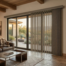 Load image into Gallery viewer, Warm Brown (Cozumel Deep Taupe) 3 1/2 Inch Signature Pvc Vertical Blinds providing a structured touch to this inviting living space, managing sunlight and privacy with smooth vertical operation.