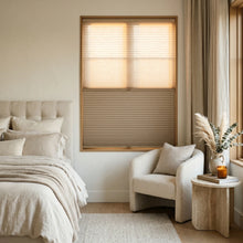Load image into Gallery viewer, Sunlight hits the Warm Brown (Plymouth) 5 8 Daynight Single Cell Cellular Cordless Shades in this modern bedroom, providing a stylish and practical window treatment solution.