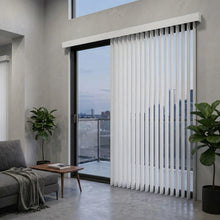 Load image into Gallery viewer, Interior view of a modern patio styled with White (Recital White) 3 1/2 Inch Signature Pvc Vertical Blinds, managing sunlight and privacy with smooth vertical operation.
