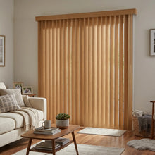 Load image into Gallery viewer, Warm wooden tones from Wood Grain Faux Wood PVC Vertical Blinds softly filter natural light in this serene living room, where a plush sectional sofa awaits.