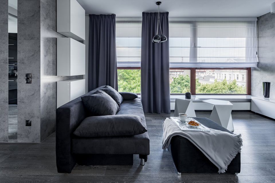 a living room with gray accents and furniture