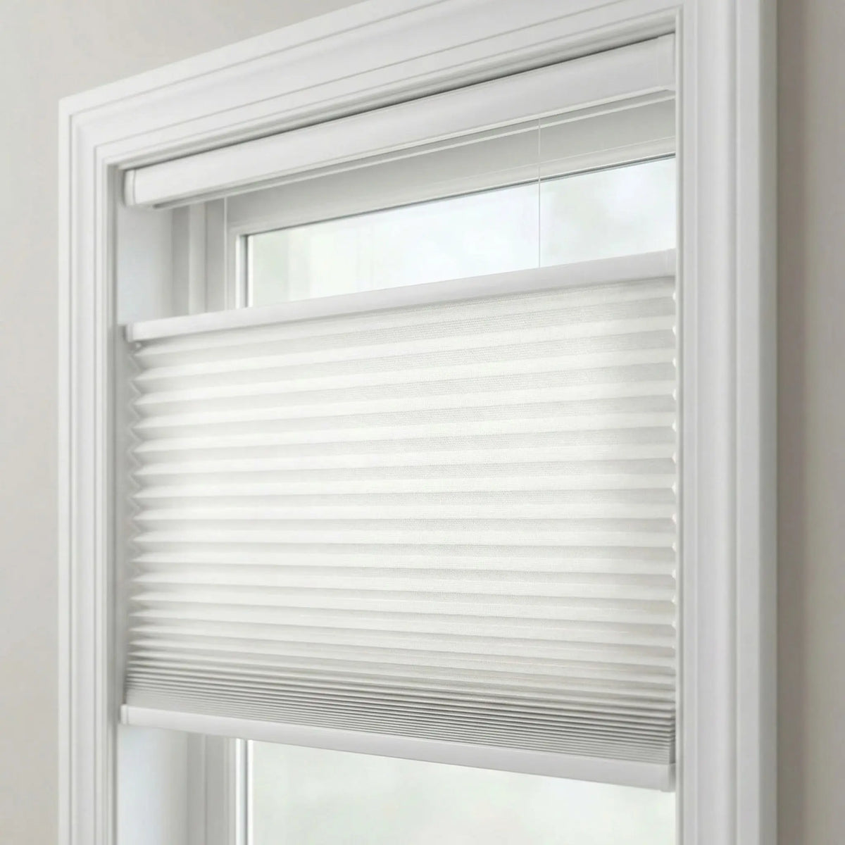Product detail shot of top-down-bottom-up pleated shades in white.