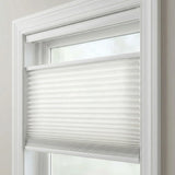 Product detail shot of top-down-bottom-up pleated shades in white.