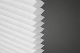 Close-up of cellular shade cell pocket design in white on a white background