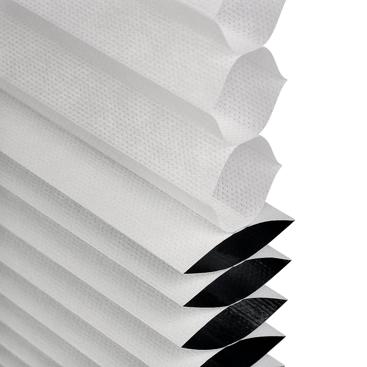 Close-up of a cellular blind honeycomb design internals showing blackout and light filtering functionality on a white background.