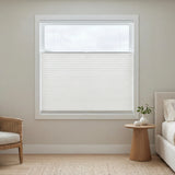 White pleated shades with top-down-bottom-up functionality in a bedroom providing privacy while giving maximum light.