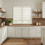 Modern kitchen with white cabinets, wooden shelves, and a window with blinds.