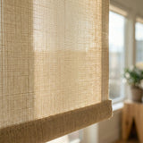 Extreme macro close-up of the Bamboo Mat beige fabric texture on a 7 percent openness solar shade, highlighting the high-quality decorative weave.
