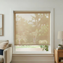 Load image into Gallery viewer, A main window view of a Luxe Decorative Solar Roller Shade in Bamboo Mat beige fabric with 7 percent openness, featured in a sunlit modern living room.

