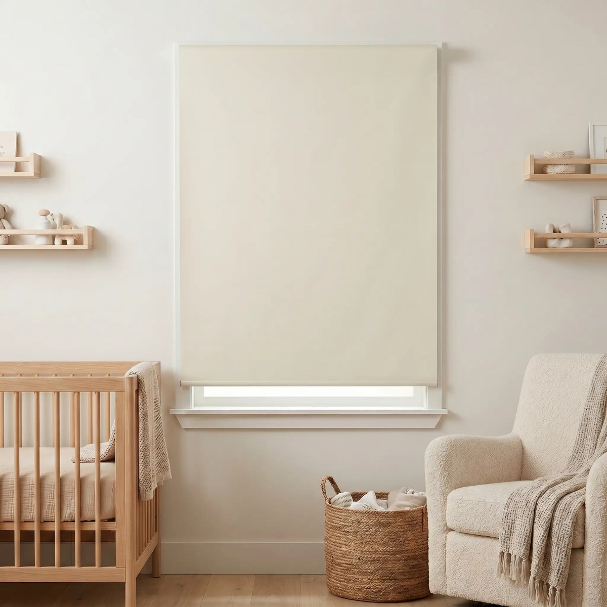 Classic Blackout Vinyl Roller Shades adorn a serene nursery, softly filtering beige-hued light and creating a cozy atmosphere.