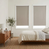 Elegant bedroom ambiance achieved with Classic Fabric Blackout Roller Shades, offering beige softness and comfort