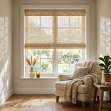 Introducing Cordless Woven Wood Shades, effortlessly filtering natural light through a neutral beige backdrop in this inviting living space