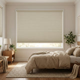 A look at Beige (Daylight) 1 2 Inch Budget Single Cell Blackout Cordless Shades inside a modern bedroom, shielding the interior from bright daylight and street lamps.