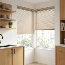 Load image into Gallery viewer, A look at Beige (Dune) Classic Cordless 6g Aluminum Mini Blinds inside a cozy room, offering lightweight yet sturdy window coverage.
