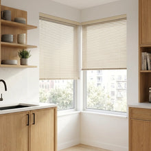 Load image into Gallery viewer, Beige (Navajo) Classic Cordless 6g Aluminum Mini Blinds providing a structured touch to a cozy living room, combining practical glare reduction with a minimalist design.
