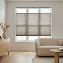 Load image into Gallery viewer, This warm reading nook is enhanced by Beige (Antique Pewter) 9 16 Classic Single Cell Light Filtering Cordless Top Down bottom Up Cordless Shades, reducing glare while letting you adjust the privacy level.
