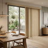 Wide view of Beige Premier Pvc Vertical Blinds complementing a inviting living space, perfect for covering sliding glass doors or large windows.